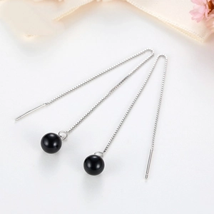 S925 sterling silver threader earrings with black agate beads on silk background
