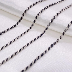 Vintage oxidized S925 sterling silver rope chain necklace displayed on white silk fabric