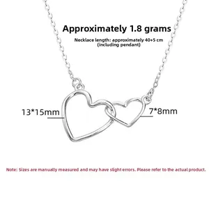 Detailed macro view of S925 silver interlocking double heart pendant necklace details