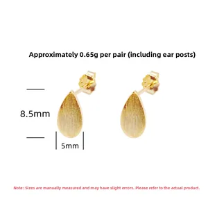 Detailed view of teardrop stud earrings with brushed gold finish and S925 hallmark stamp