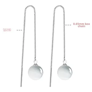 Detailed view of 8cm long S925 silver box chain earrings with white cat eye stone