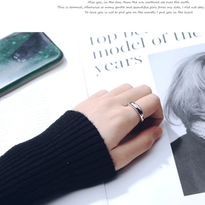 Polished S925 sterling silver minimalist ring worn by a model in a stylish setting
