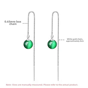 Detail view of 8cm silver box chain drop earrings with green agate stone beads
