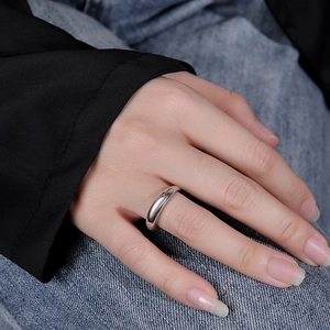 Minimalist S925 sterling silver ring shown on a hand with a polished finish detail