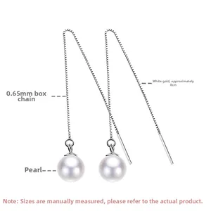 Detail of 0.65mm silver box chain and shell pearl pendant on long drop earrings
