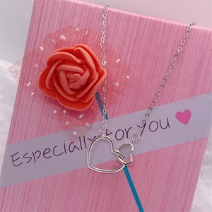 S925 sterling silver double heart pendant necklace displayed on a decorative gift box
