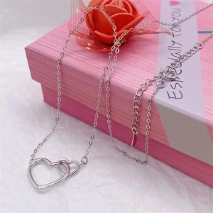 Minimalist S925 sterling silver interlocking double heart necklace on pink gift box