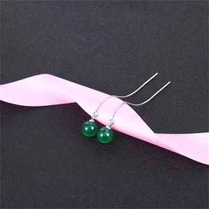 Detail of S925 sterling silver drop earrings with translucent green agate beads
