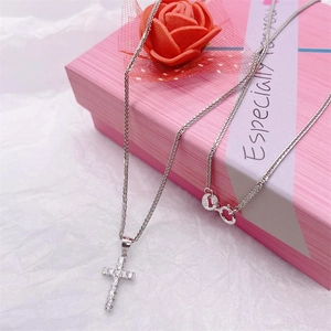 Sparkling S925 sterling silver cross pendant necklace with cubic zirconia on pink gift box