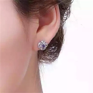 Elegant S925 sterling silver stud earrings with a purple gemstone and celtic knot design