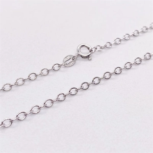 Macro view of S925 sterling silver cross chain necklace with Italy and S925 hallmarked tags