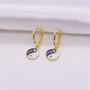 S925 sterling silver Tai Chi Yin Yang dangle earrings with gold finish on white silk