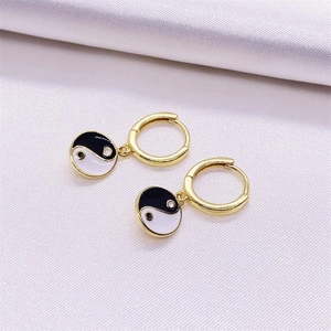 Pair of gold S925 silver hoop earrings with black and white Yin Yang enamel charms