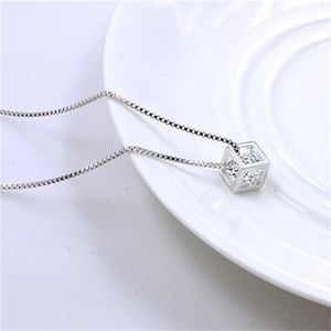 S925 Sterling Silver Cubic Pendant Necklace with shimmering crystals on white ceramic