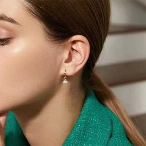 Elegant S925 silver gold-plated hoop earrings featuring a lustrous white pearl pendant