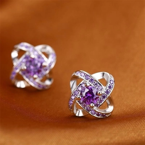 Elegant S925 sterling silver four-leaf clover stud earrings with purple zircons