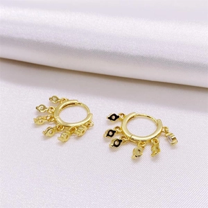 Elegant gold S925 silver hoop earrings with multiple hanging stone charms on white silk