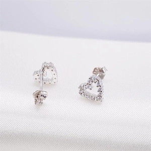 Elegant S925 sterling silver hollow heart stud earrings with sparkling zircon stones