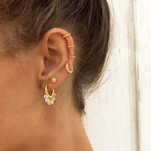 S925 sterling silver gold earrings set with zircon studs and cuffs shown on model