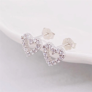 Sparkling S925 sterling silver hollow heart stud earrings with cubic zirconia stones