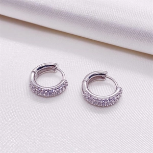 Sparkling S925 sterling silver hoop earrings with triple row zircon stones on silk fabric