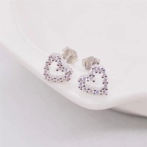 Sparkling S925 sterling silver hollow heart stud earrings with cubic zirconia stones
