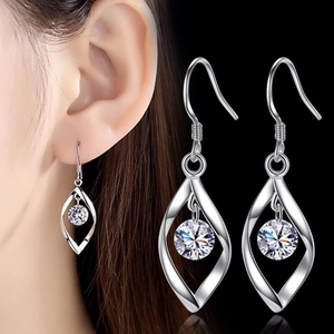 Macro shot of S925 sterling silver twist earring with a sparkling round zircon stone