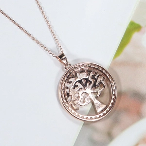 Collier avec pendentif Arbre de Vie rond en or rose et design élégant évidé chic