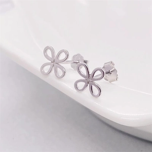 Minimalist S925 sterling silver hollow flower stud earrings with polished finish