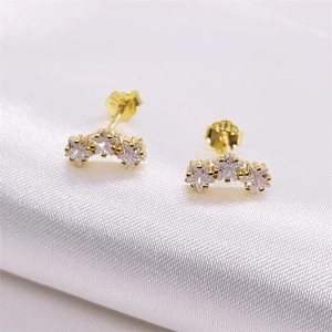 S925 sterling silver star stud earrings with sparkling cubic zirconia on white silk