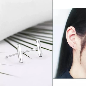 Minimalist S925 sterling silver bar stud earrings showing macro detail and on-ear look