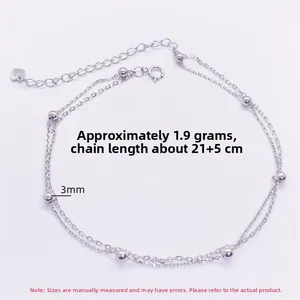 Detail of S925 sterling silver double-layer bead anklet with heart tag and lobster clasp