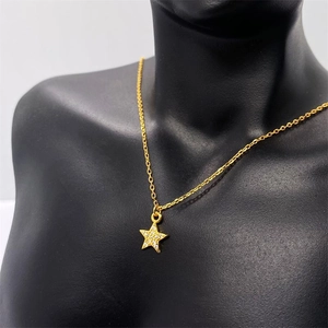 Detailed shot of S925 sterling silver star pendant with pave zircon in gold plating