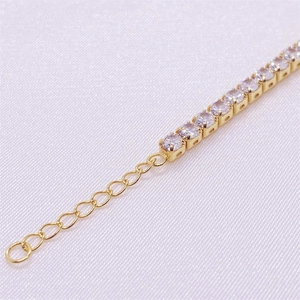 Macro detail of gold S925 silver tennis bracelet with sparkling zircon stones