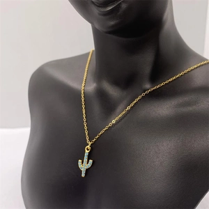 Detail of S925 silver cactus necklace with blue stones on a black mannequin