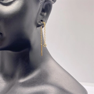 Detail of 925 sterling silver chain earrings with long bar drop on a black display