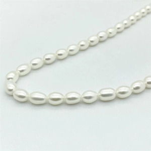 Close-up of irregular freshwater pearl necklace with natural white luster and silver clasp