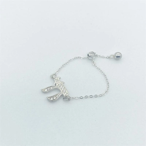 Macro view of adjustable silver chain ring with Chai pendant and cubic zirconia
