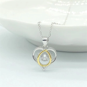 S925 sterling silver heart pendant with sparkling central zircon and gold accents