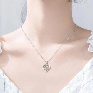 Close-up of S925 sterling silver heart pendant necklace worn on a female neck