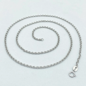 Macro shot of S925 sterling silver O-chain necklace with a spring clasp and logo tag