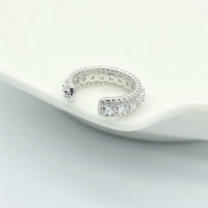 S925 sterling silver ear cuff with cubic zirconia stones shown on white ceramic