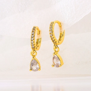 Close-up of S925 silver teardrop earrings with gold plating and paved zircon stones