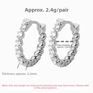 Close-up of S925 sterling silver twisted hoop earrings with micro-inlaid diamonds details