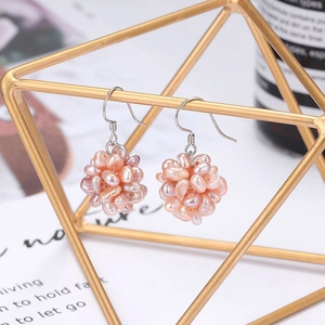 Pink cluster freshwater pearl earrings on silver hooks with a woven baroque style design