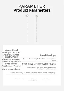 Détail des boucles d'oreilles pompons en argent S925 de 46mm avec perles naturelles