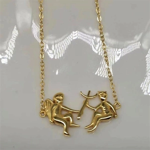 Detail of gold plated S925 sterling silver chain with romantic Cupid angel pendants