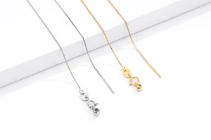 Detailed macro view of S925 sterling silver box chains with Italy hallmark and bead ends
