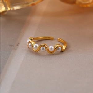 Elegant 18k gold wavy pearl open ring with five white pearls in a minimalist design
