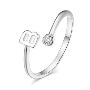 Detailed close-up of 925 sterling silver open ring with letter B and zircon stone